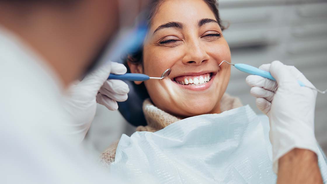 Happy woman during dental exam