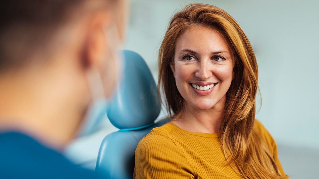 Woman listening to dental hygienist