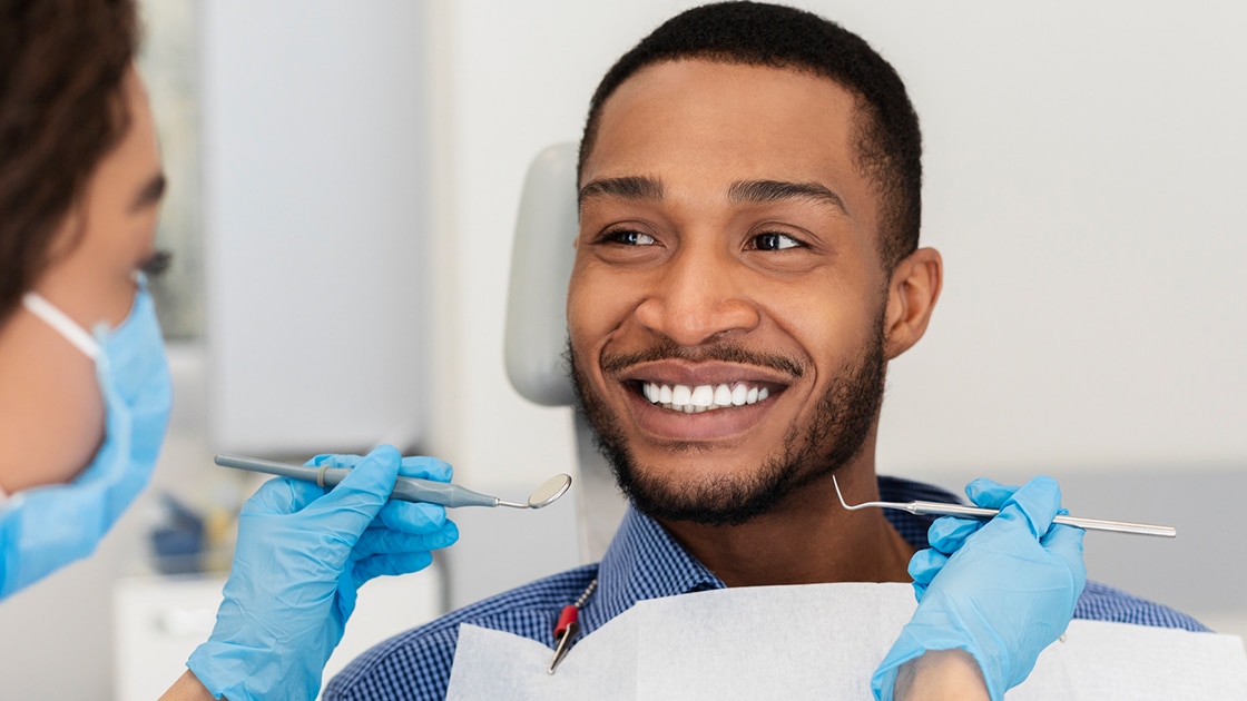 Man Smiling during Oral Exam