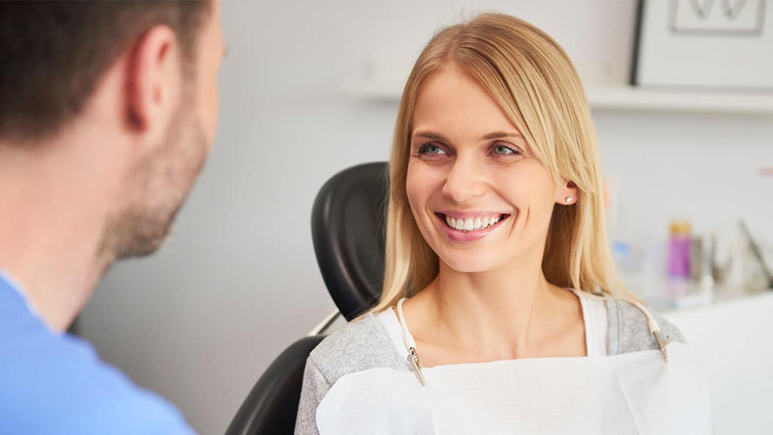 Woman smiling at dentist